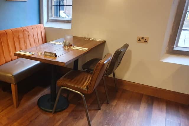 The tables are spaced out and come with comfortable seating