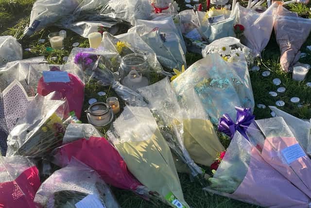 Floral tributes left at the scene in at Stowlawn playing fields in Wolverhampton. Photo: Matthew Cooper/PA Wire.