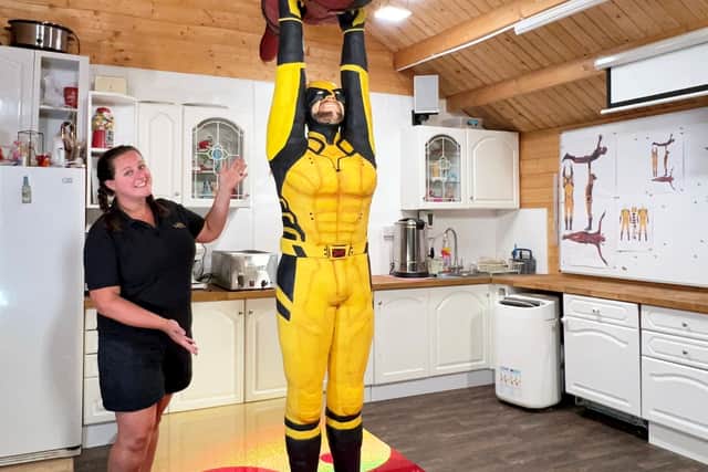 Lara Mason from Walsall whose latest cake creation is of Marvel superheroes Deadpool and Wolverine. Photo: Lara Mason / SWNS