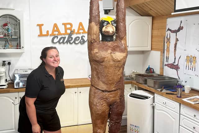 Lara Mason from Walsall whose latest cake creation is of Marvel superheroes Deadpool and Wolverine. Photo: Lara Mason / SWNS