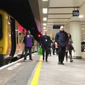 A West Midlands Railway train on a platform at Birmingham New Street