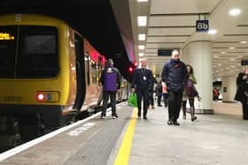 A West Midlands Railway train on a platform at Birmingham New Street