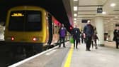 A West Midlands Railway train on a platform at Birmingham New Street