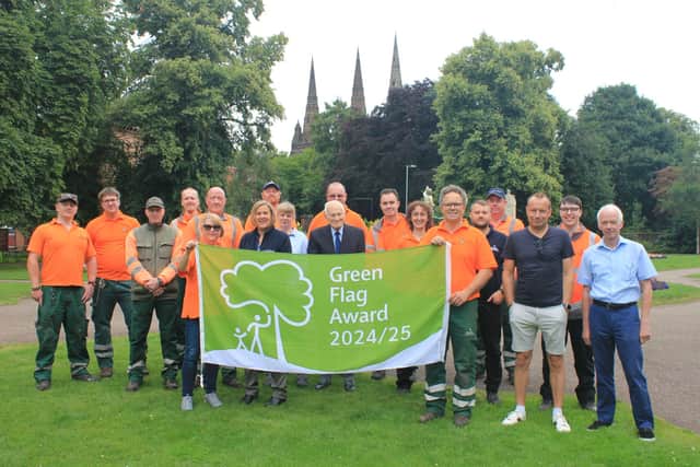 Members of staff at Beacon Park celebrate the Green Flag award