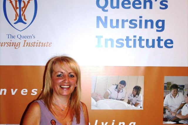 Janine as a Specialist Community Public Health Practitioner receiving her Queen's Nursing Institute Award.