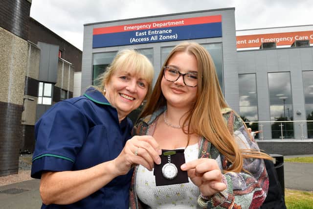 Janine McKnight passes her watch on to her hard-working niece, Tegan Wood, who will soon follow in her auntie's footsteps.