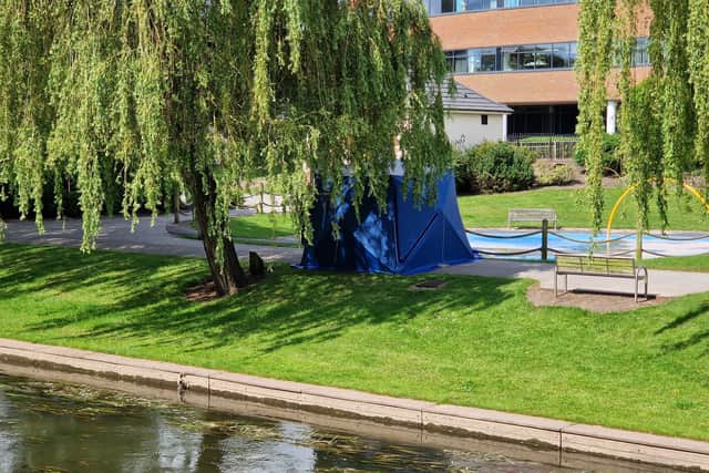 The park remains cordoned off with a tent still in place near the children's playground in Victoria Park