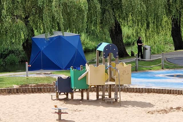 The park remains cordoned off with a tent still in place near the children's playground in Victoria Park