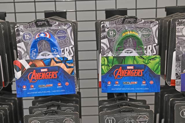 The mouthguards feature the symbols of all the major heroes of the Avengers team