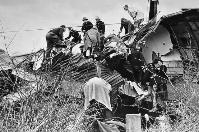 Emergency workers trying to rescue people from the wreckage