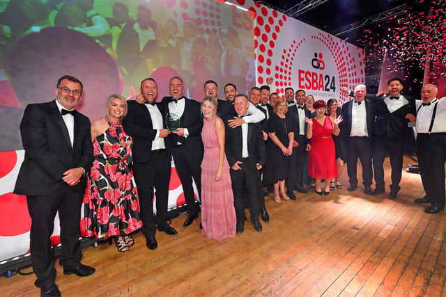 Editor Mark Drew, left, with Inco Contracts celebrating winning Business of the Year