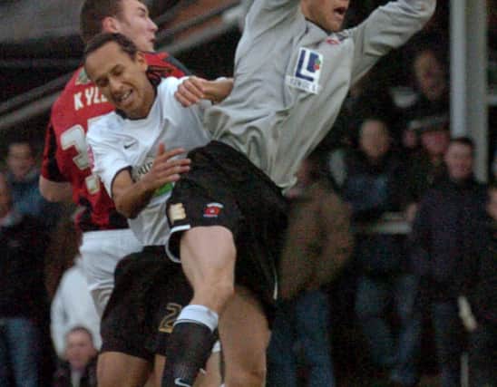 Hereford United's new loan signing Joshua Gowling is beaten to a cross by Hartlepool United goalkeeper Jan Budtz.