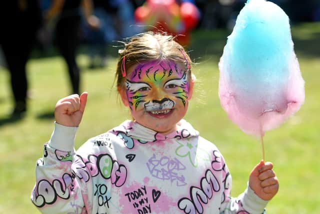 It's candy floss time for Luna Rubery, aged four.