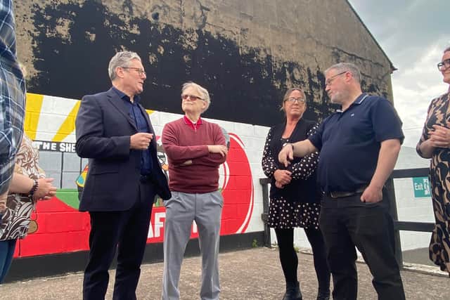 Sir Keir Starmer speaking with voters at Stafford Rangers FC in Stafford