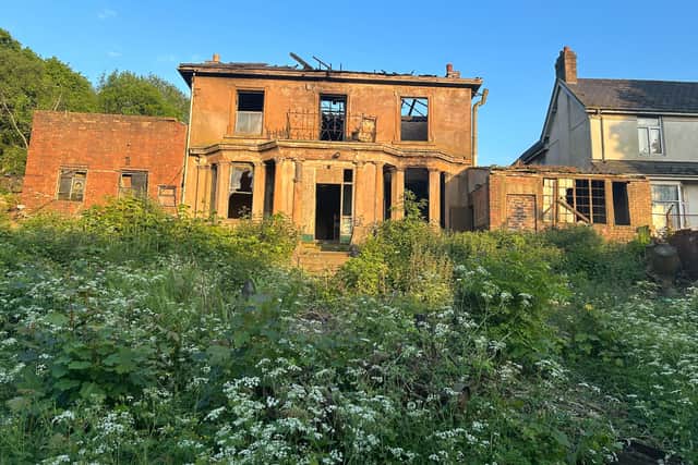 The outside of the derelict building