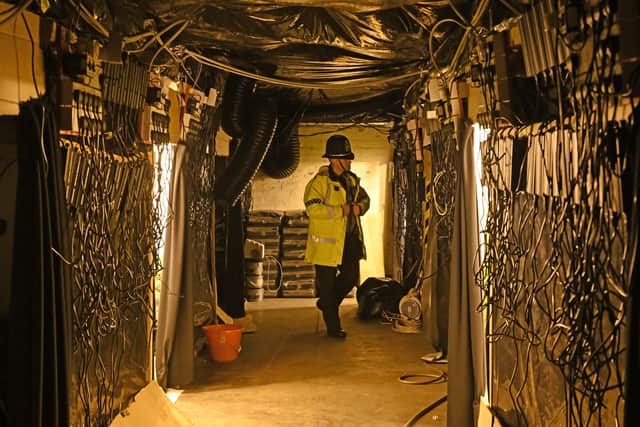 Police in the factory after the raid