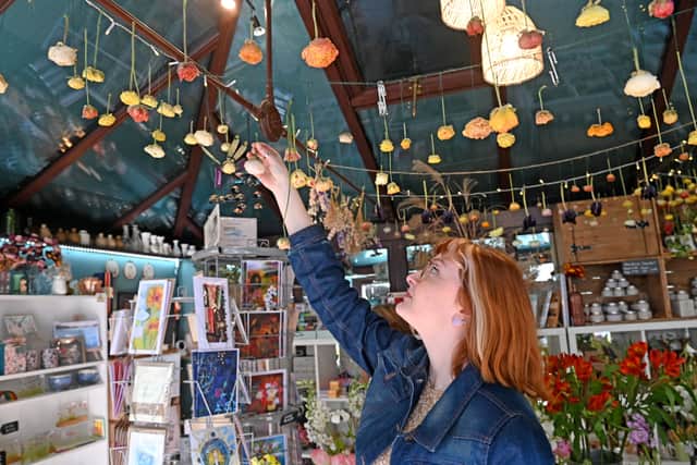 Heather and Vanessa dry flowers in the shop for floral arrangements and bouquet