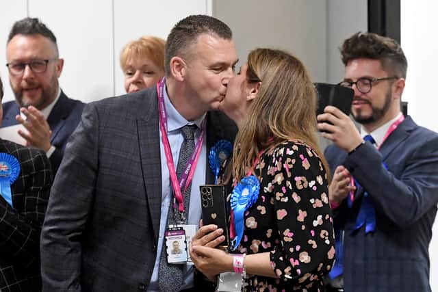 Tory Tim Wilson celebrates retaining his seat