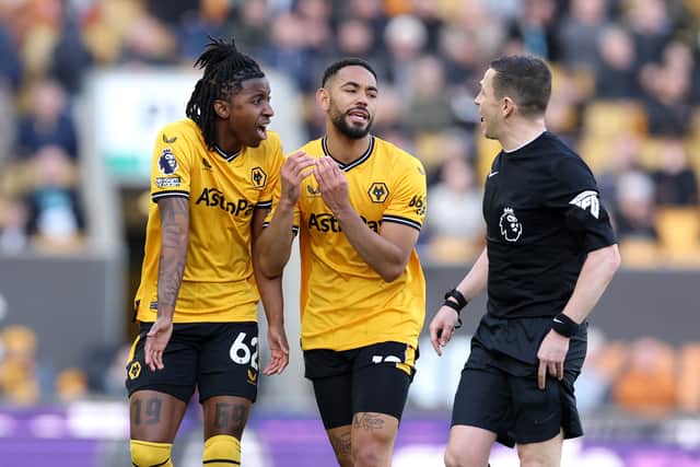 Tawanda Chirewa and Matheus Cunha of Wolverhampton Wanderers react towards Referee Tony Harrington (Photo by Jack Thomas - WWFC/Wolves via Getty Images).