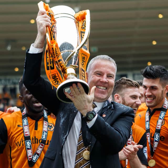 Kenny Jackett lifts the League One trophy