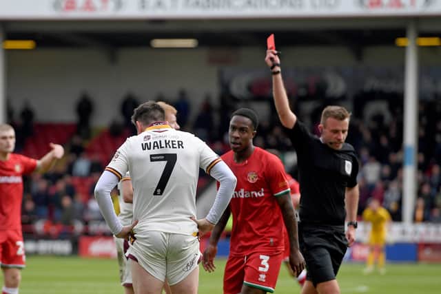 Jamie Walker is shown the red card