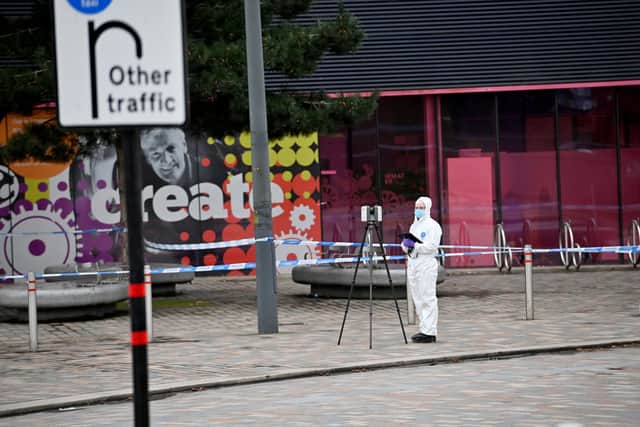 A forensic investigator at the scene on Monday morning