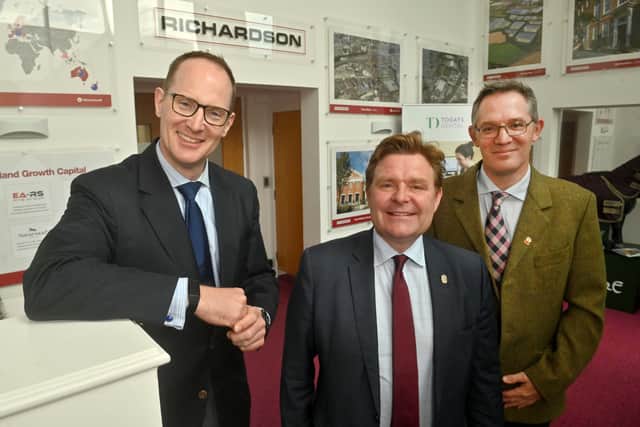 A photograph taken by Express & Star photographer Steve Leath in Oldbury at Richardsons. The image features Carl and Martyn Richardson, as well as John Cotton of Birmingham Council.