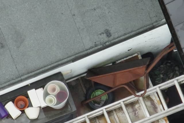 The drone footage shows the two men hiding behind a fence. Photo: WMP Eye in the Sky