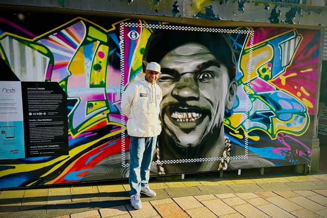 Musician, actor and artist Goldie with the commission of him by artist Eve Whitfield which also features some of his work.