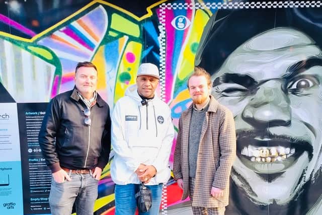 Goldie (middle) with Joe Nixon (left) and Josh Smith from Arts Creative who deliver the Street Stories project in front of the artwork