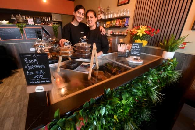 Simmy Kaur and Dolly Mann are part of a welcoming team at the cafe