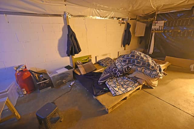 Four makeshift beds, tightly packed together were found next to the cooking facility