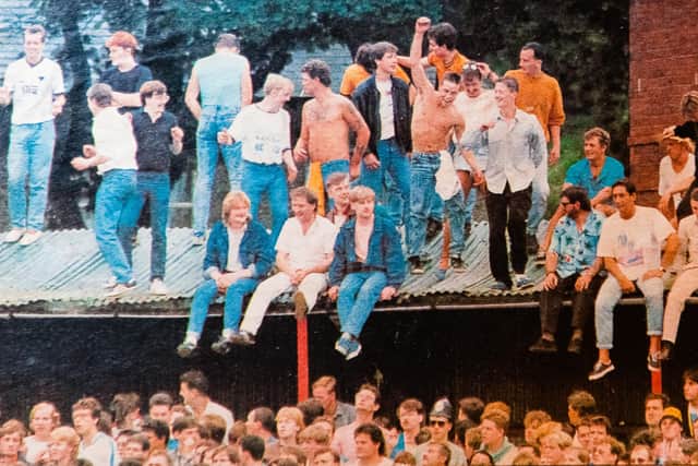 Wolves fans clamber on to the stands at Scarborough