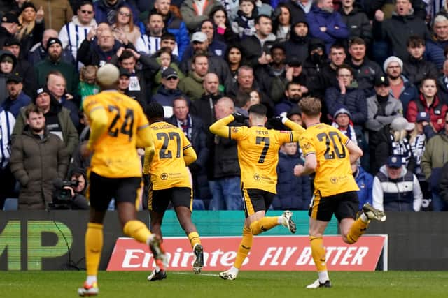 Wolverhampton Wanderers' Pedro Neto (second right) celebrates in front of the West Bromwich Albion fans