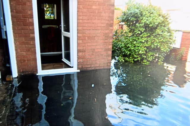 Water at the door of a house