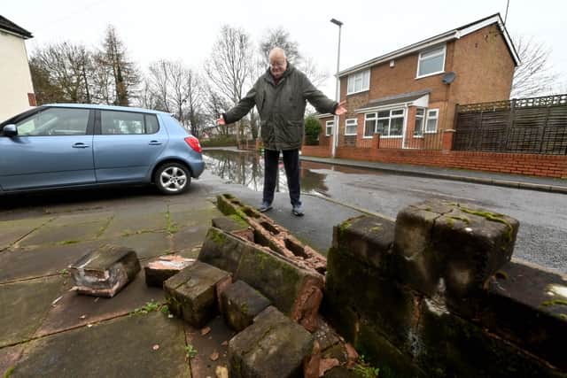 Millward Street resident Alan Lunn's garden wall was demolished by a car trying to avoid the flood water.