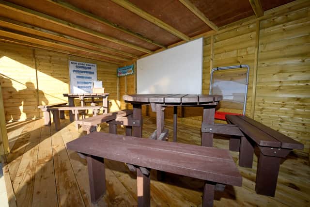 The outdoor classroom which is constructed mostly of wood