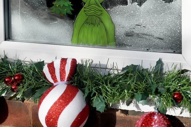 Gavin even sprayed and decorate the windows for that extra Grinchmas feeling
