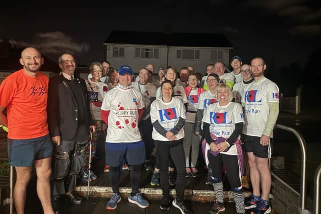 Sedgley Striders ahead of their Poppy Run, pictured with Army veteran Chris Banks