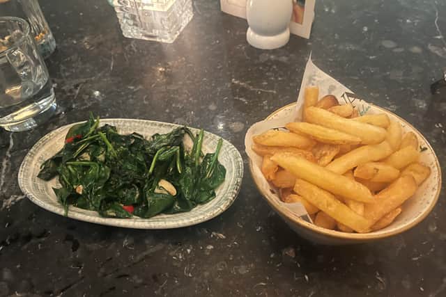 Garlic baby spinach and truffle and cheese potato fries.