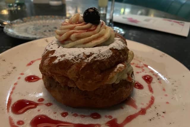 The delectable Zeppola: a soft choux bun with vanilla cream and amarena cherries.