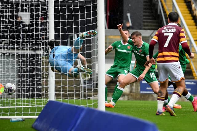 .Harry Lewis leaps for the ball but fails to stop Aramide Oteh's goal