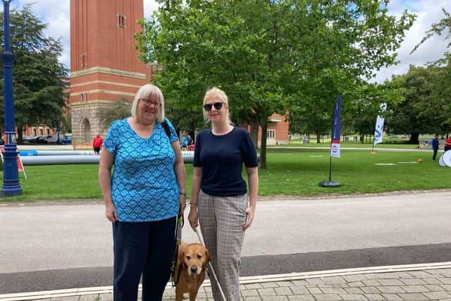 Clare Williams and Louise Connop from Birmingham Sight Loss Council with guide dog Quita at the University of Birmingham. Credit: LDRS.