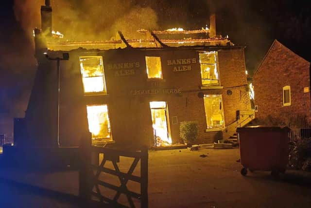 The Crooked House burning. Photo: Chris Green