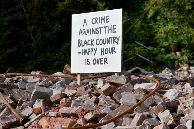 Rubble at the scene where The Crooked House once stood
