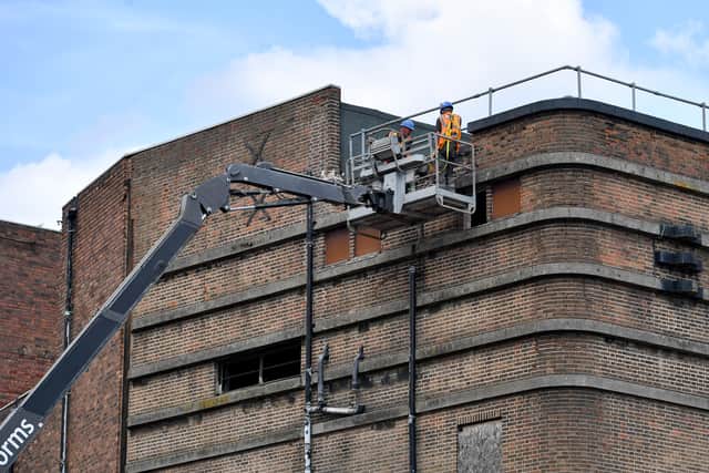 Workmen begin to dismantle the roof of Dudley Hippodrome