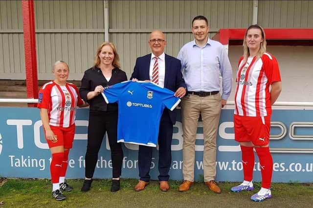Brendan Wall, fourth from left, with April Pearson-Myatt, second from left, when they recently visited Stourbridge FC to sign a new sponsorship deal