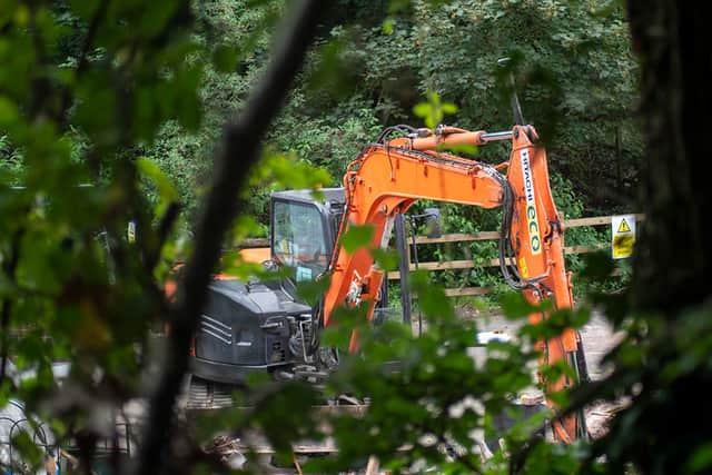 Construction workers have been spotted on the site where The Crooked House once stood