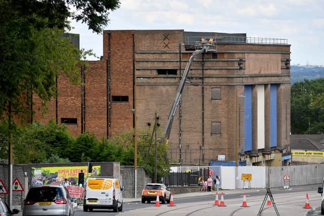 Workmen begin to dismantle the roof of Dudley Hippodrome