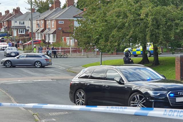 The area around the block of flats on Guy Avenue was taped off, with cars and police everywhere